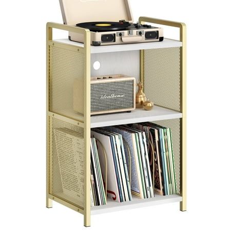 an old record player is sitting on top of a shelf filled with records and cds