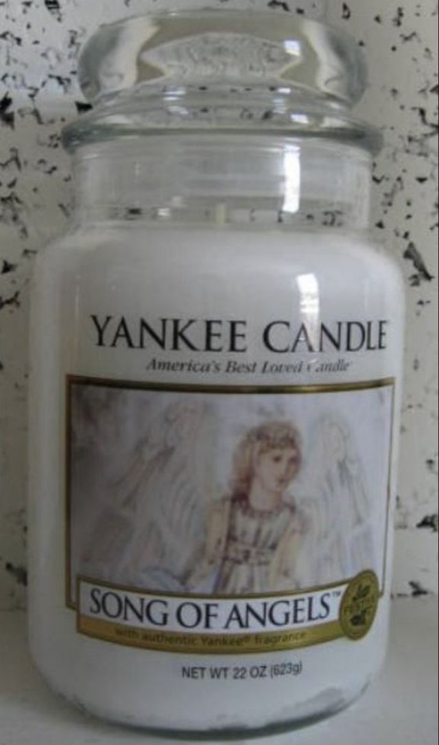 a yankee candle with an angel on it