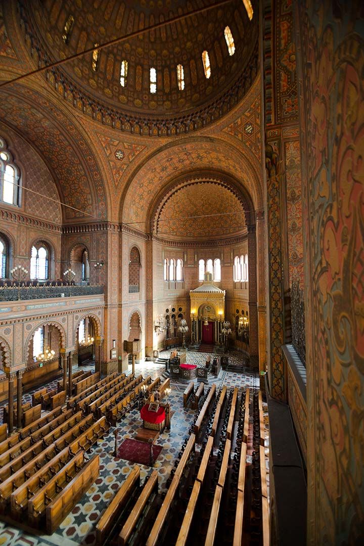 an ornately decorated church with stained glass windows