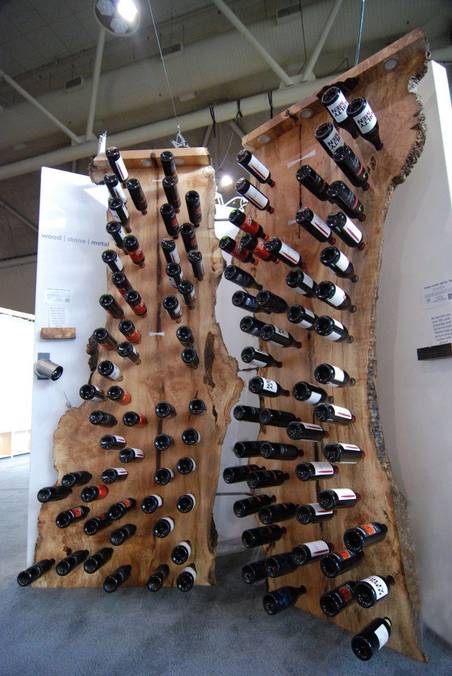 two wooden racks with wine bottles on them