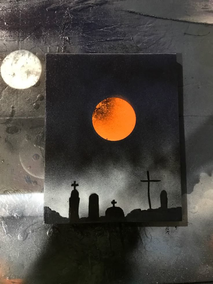 a black and white photo with the moon in the sky above cemetery silhouetted by tombstones