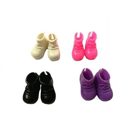 four pairs of baby shoes are shown in different colors and sizes on a white background