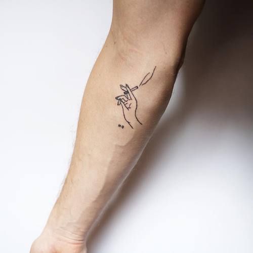 a person with a small tattoo on their arm