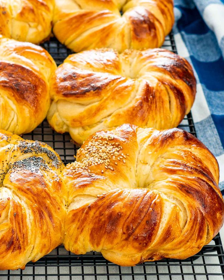 freshly baked croissants cooling on a wire rack