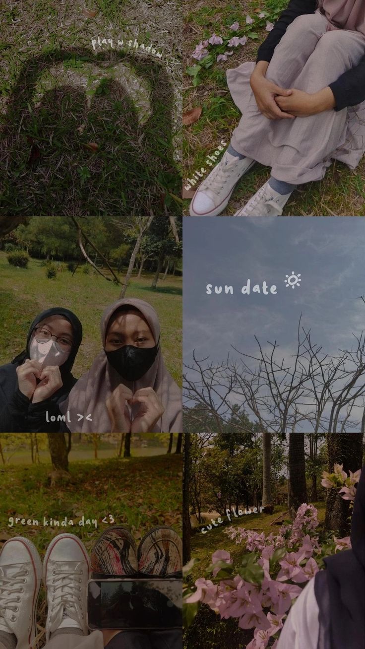 two people sitting on the ground with their faces covered by masks