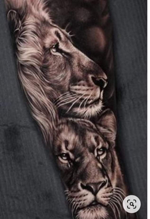 a man's arm with two lions on it and one is black and white