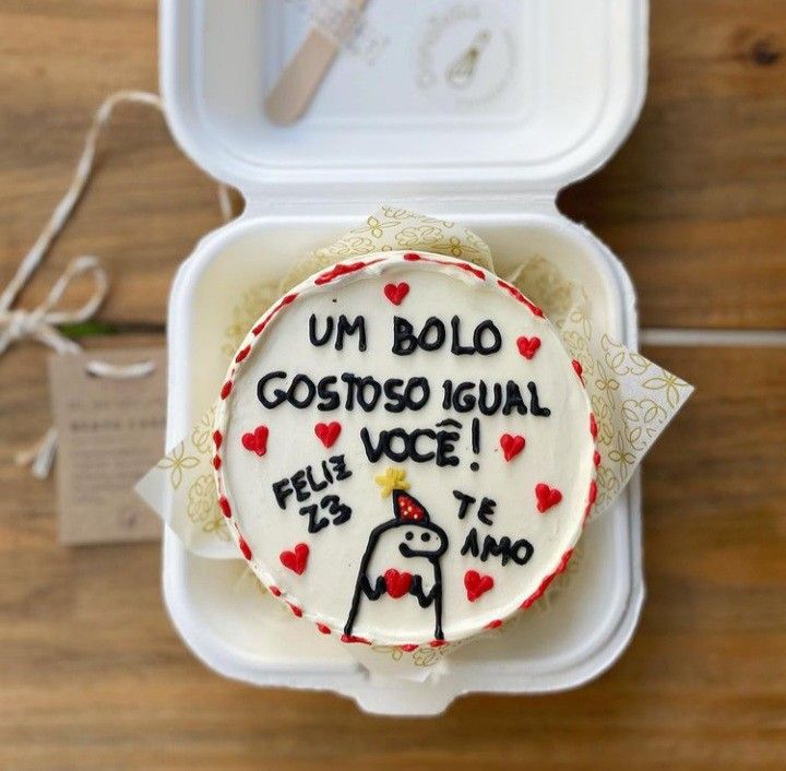 a cake in a box with writing on it