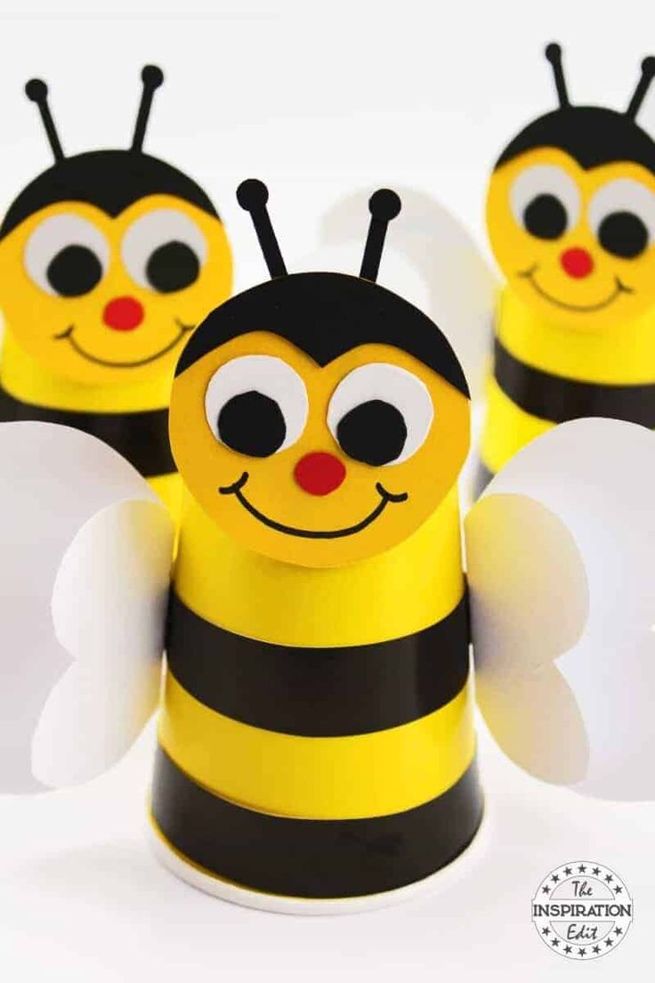 three bees made out of toilet paper with eyes and antennae on them, sitting next to each other