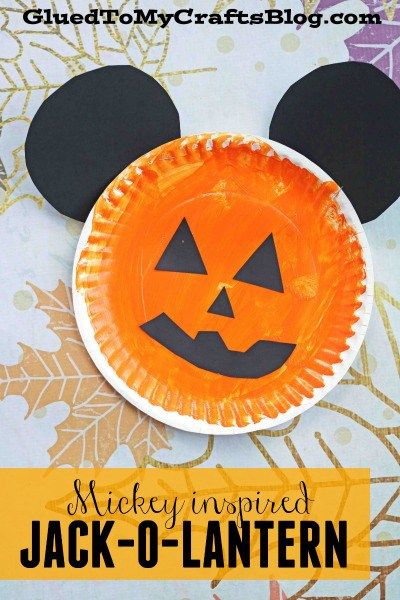 a paper plate with mickey mouse's face on it and the words mickey inspired jack - o - lantern