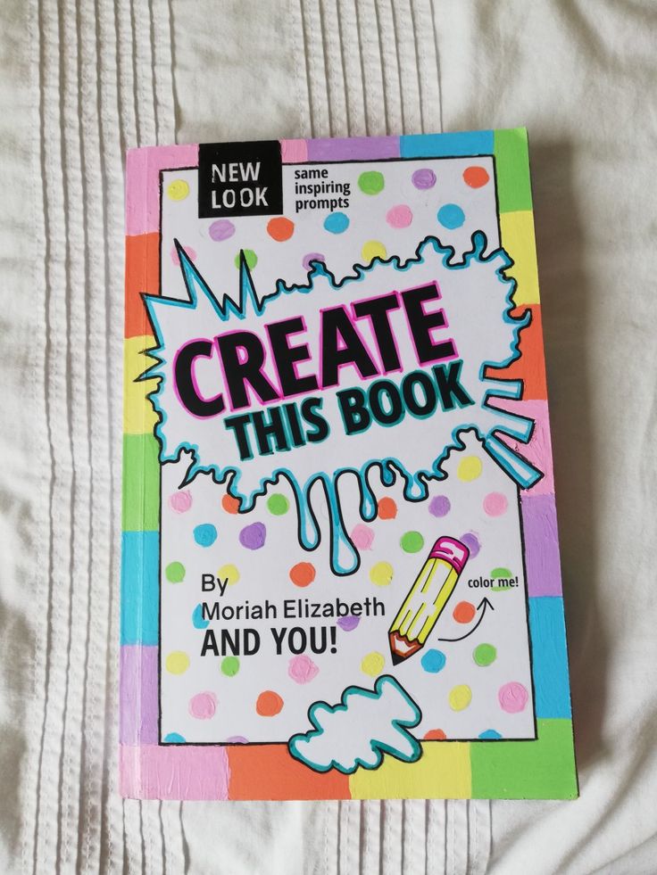 a book that is laying on top of a white bed sheet with the title'create this book and you '