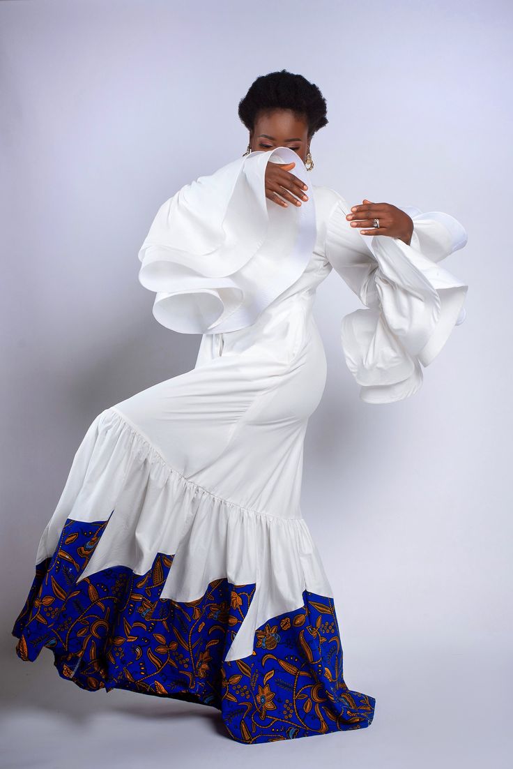 Exaggerated sleeves shirt dress with with an African print asymmetric twist Interesting Dresses, African Elegance, African Print Clothing, Exaggerated Sleeves, Elegance Style, Dress Shirt Sleeves, African Wear, Traditional Clothing, Dress Clothes For Women