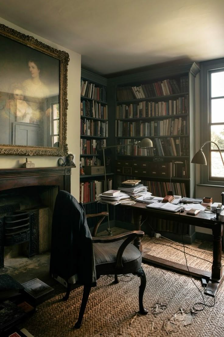 a room with a desk, bookshelf and fireplace