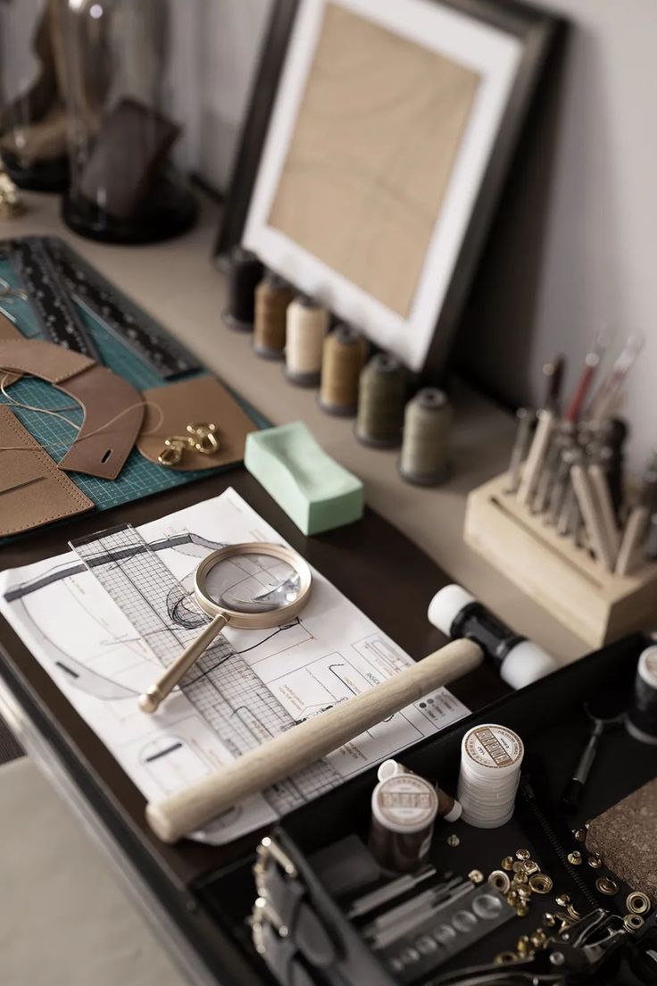 a desk with some crafting supplies on it