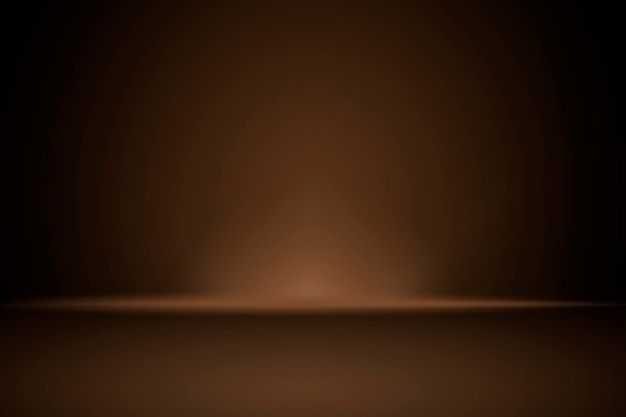 an image of a dark brown background that looks like it has light coming from the top