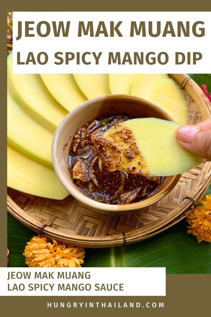 a person dipping some food into a bowl