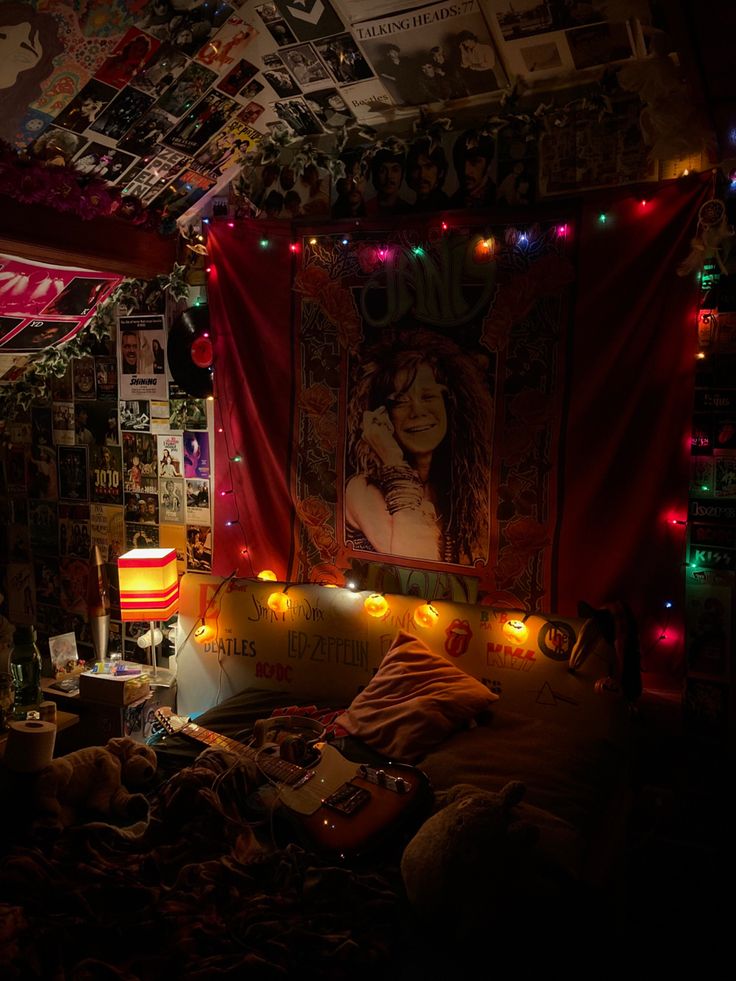 a bedroom with lights and posters on the wall