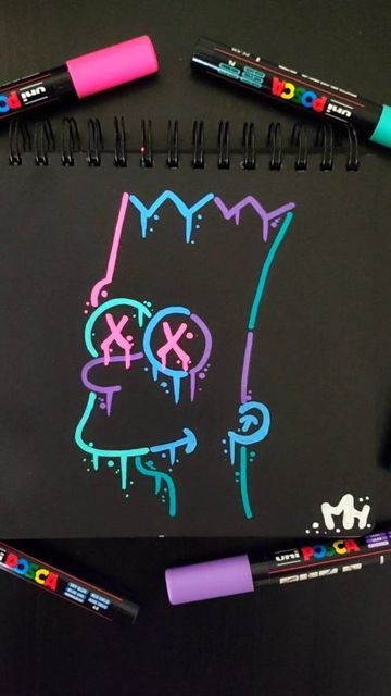 some markers are laying on top of a blackboard with neon colored inks in the shape of a cartoon character