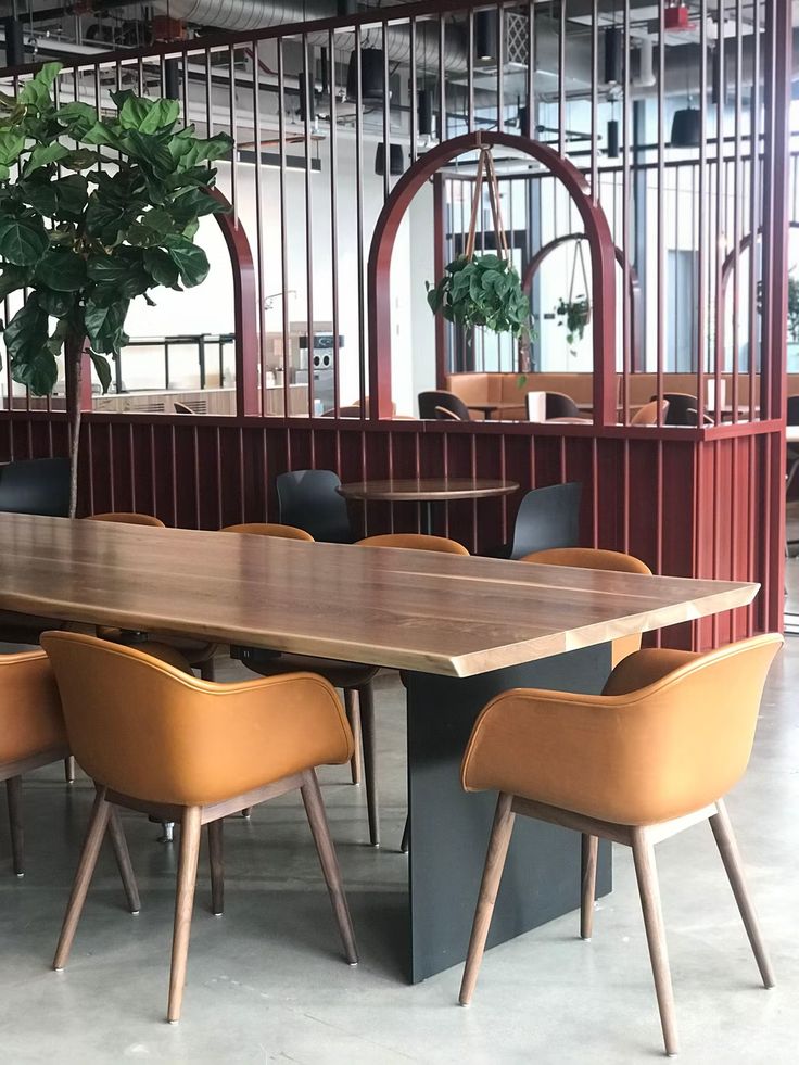 a large wooden table with chairs around it