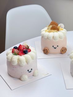 three small cakes are sitting on top of each other