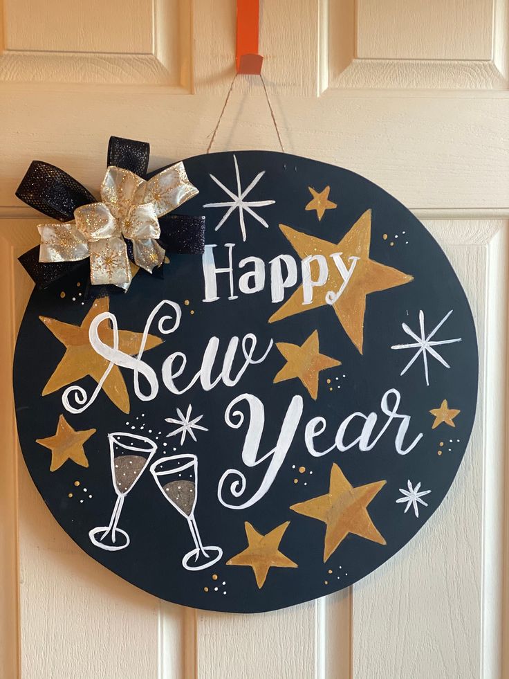 Gorgeous Happy New Year door hanger!  What better way to bring in the New Year than with this beautiful door hanger!  Made of wood and hand painted!  It is black with gold glittery stars two champaign glasses to bring in the cheer, snowflakes and a bow!  This would be an awesome invite to all your family and friends for a New Year Champaign Glasses, Happy New Year Signs, Happy Penguin, Chalkboard Designs, Happy Everything, New Year's Crafts, New Years Eve Decorations, Beautiful Doors, Wreath Designs