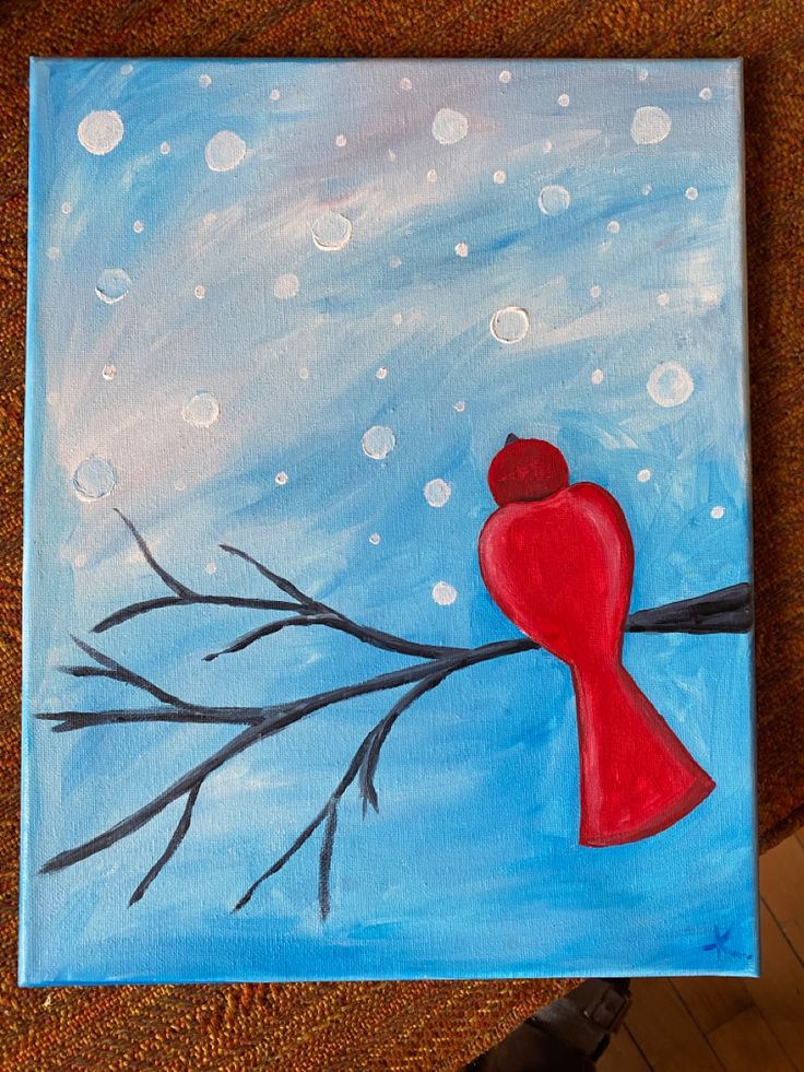 a painting of a red bird perched on a tree branch with bubbles in the background