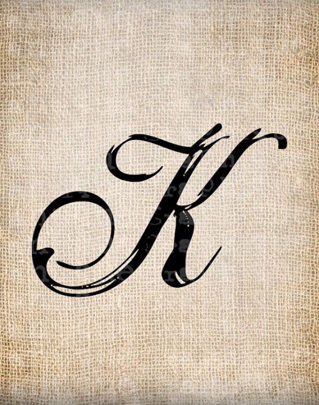 the letter k is made up of black ink on an old paper with some type of writing