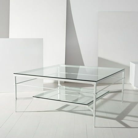 a glass table sitting on top of a white floor