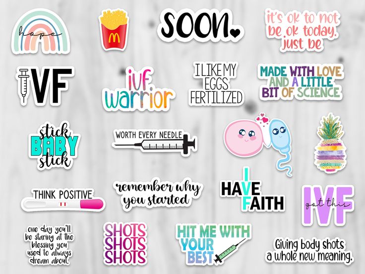 some stickers that are on top of a wooden surface with words and phrases in different colors