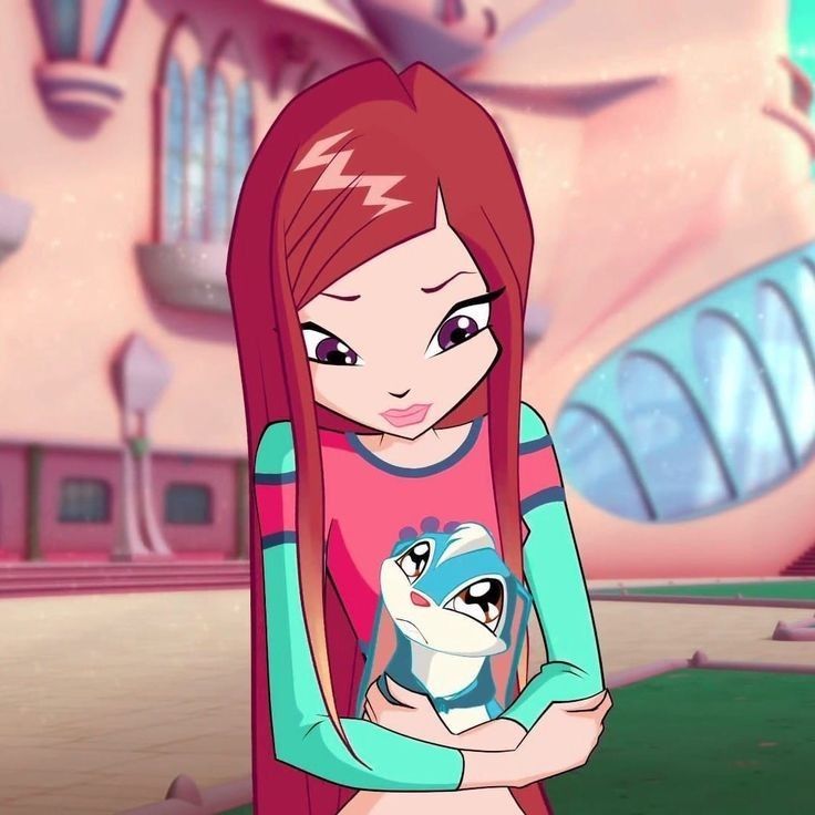 a girl with long red hair holding a stuffed animal