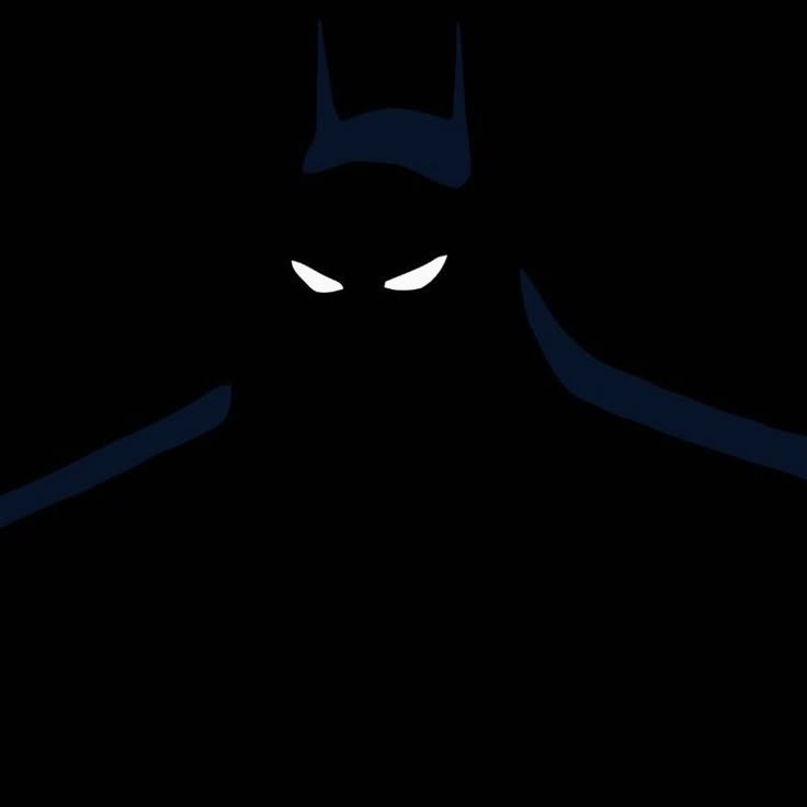 an image of a batman in the dark with glowing eyes and fangs on his face