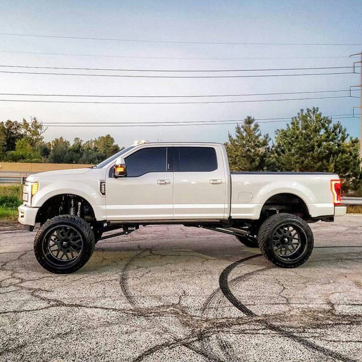 a white truck parked in a parking lot