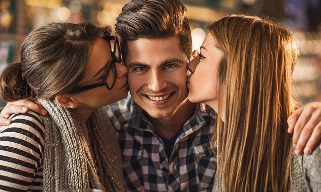 three people kissing each other while standing next to each other