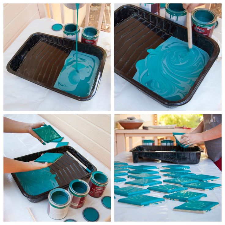 the process of painting blue paint on a tray