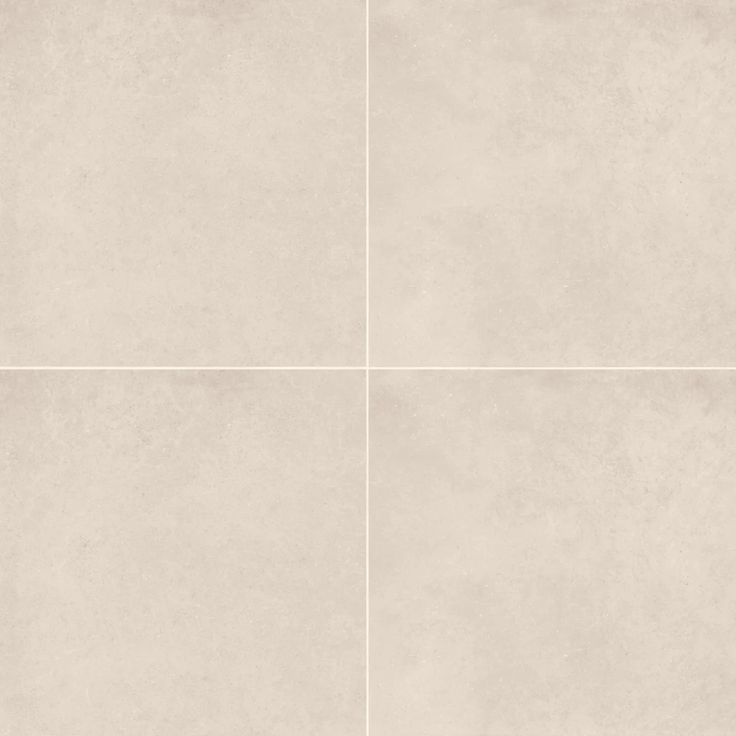 four squares of white tile on a wall