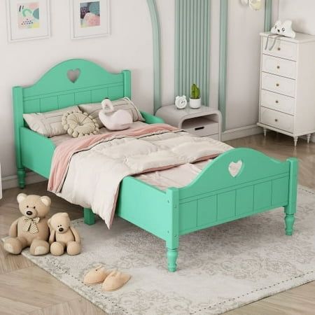 a bedroom with a bed, dresser and two teddy bears