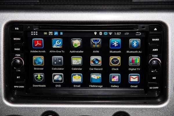 an image of a car radio with various apps on the front panel and in the center