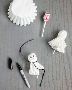 various items are arranged on the table to be used for halloween decorations, including toothbrushes and candy