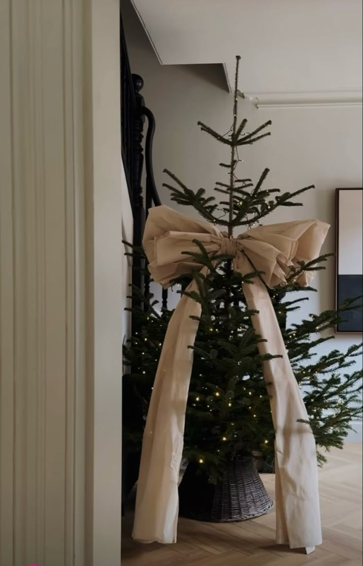 a decorated christmas tree in the corner of a room