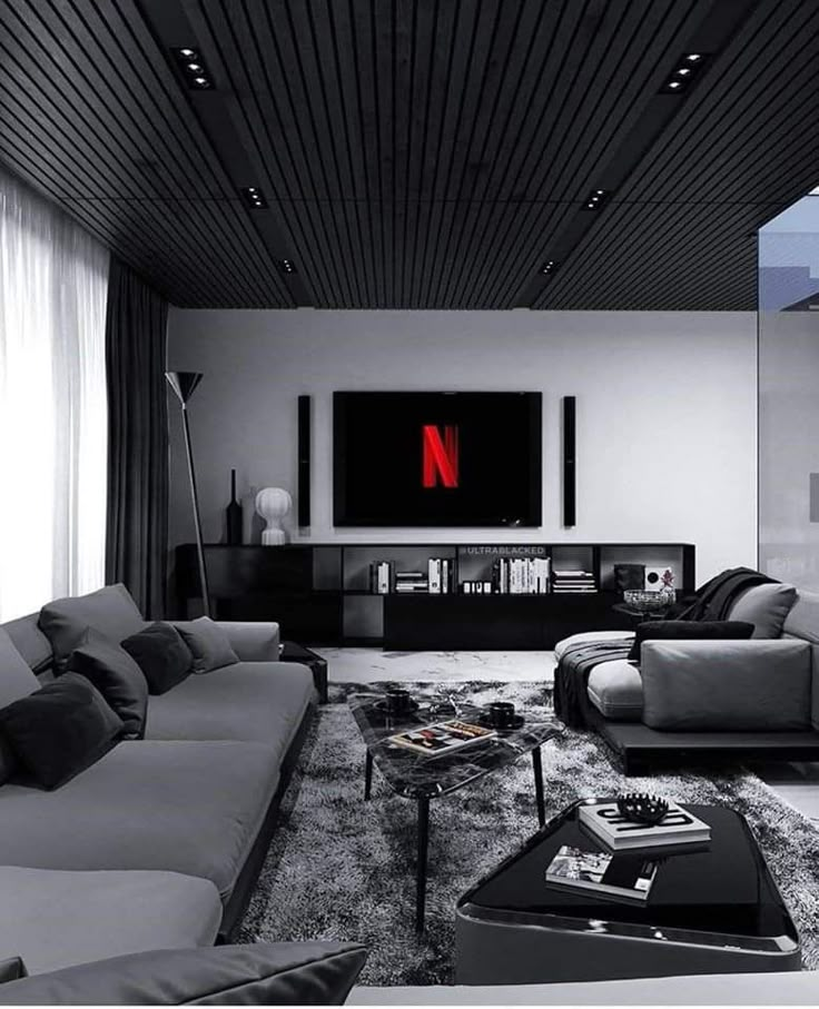 a modern living room with black and white furniture