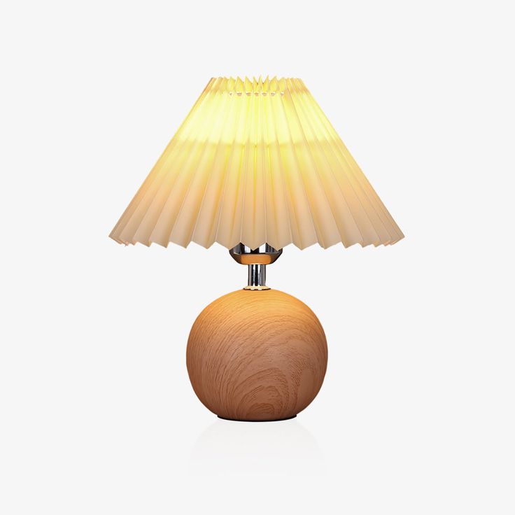 a wooden table lamp with a yellow shade on it's base and a white background