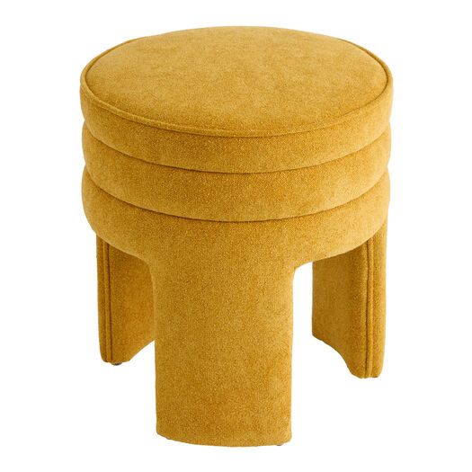 a yellow stool that is sitting on the ground