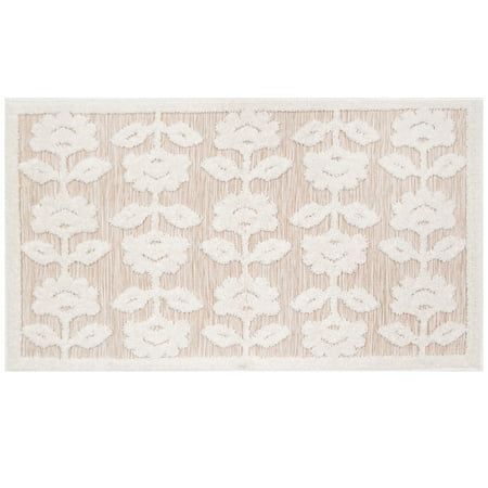 a white rug with an intricate design on the front and back of it, in neutral tones