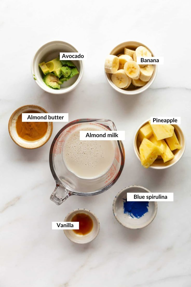 the ingredients to make this smoothie include bananas, avocado, almond milk, and blue spirdina