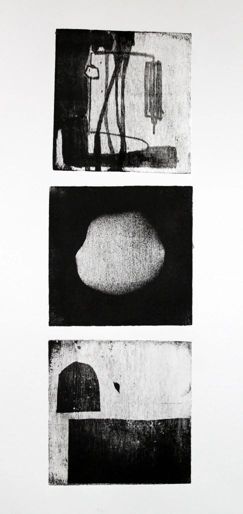 three black and white images with one light on