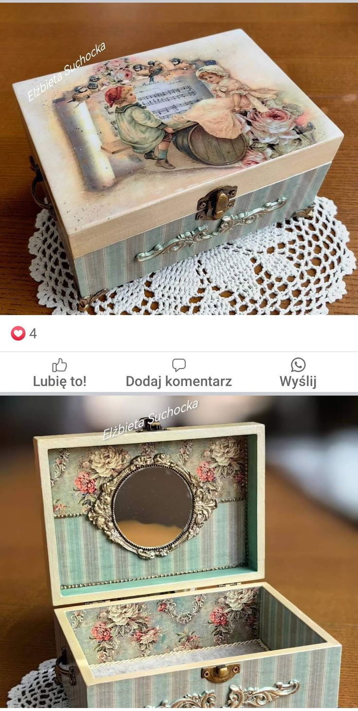 an open box sitting on top of a wooden table next to doily and lace