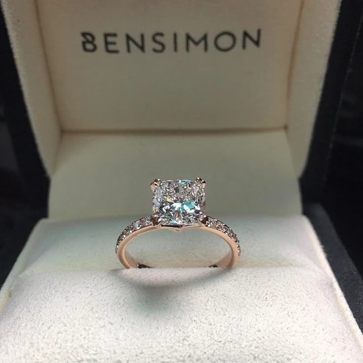 an engagement ring in a box with the name bensimon on it's side