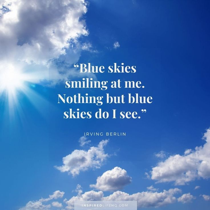 blue skies and white clouds with a quote from irving behrin on the sky