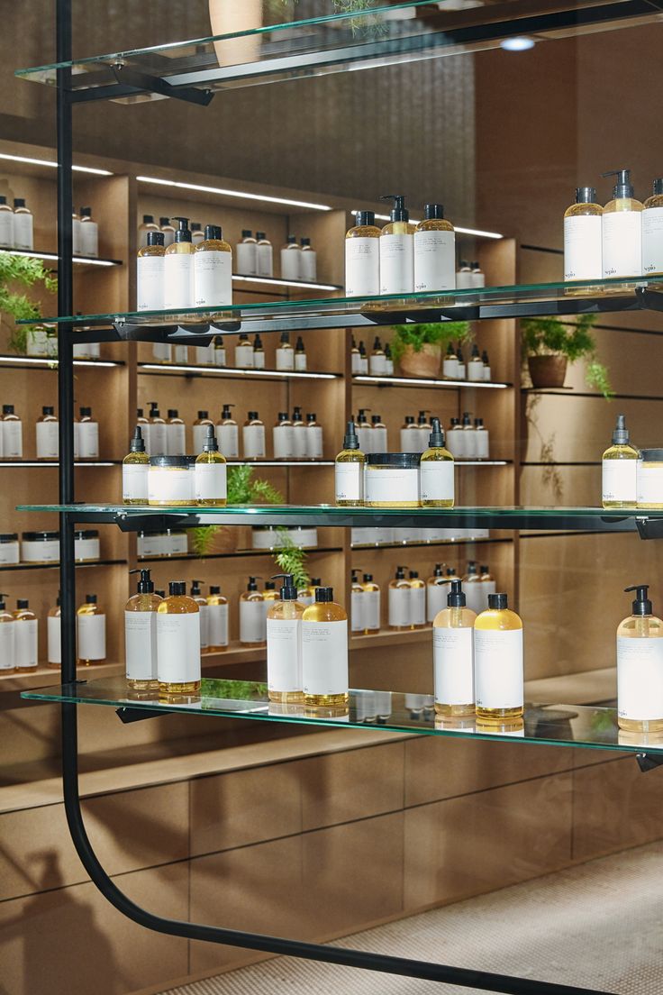 the shelves are filled with many different types of soaps and lotions in bottles