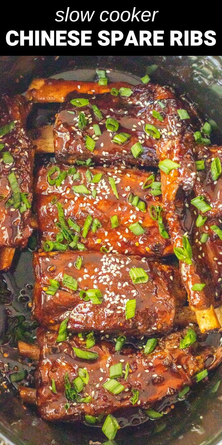 slow cooker chinese spare ribs with sesame seeds and scallions in a pan