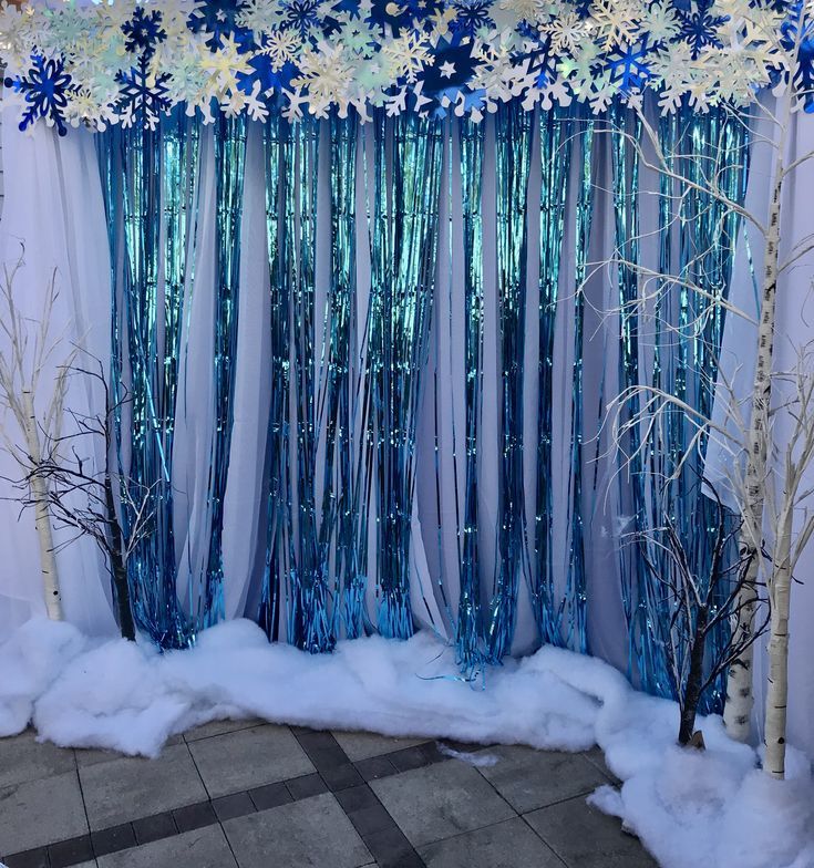 the backdrop is decorated with blue and white flowers